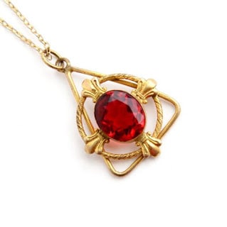 Attractive-Triangular-Single-Ruby-Stud-Gold-Pendant