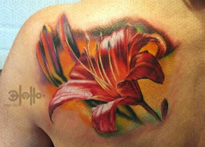 Stunning-Orange-lily-On-Waves-Tattoo