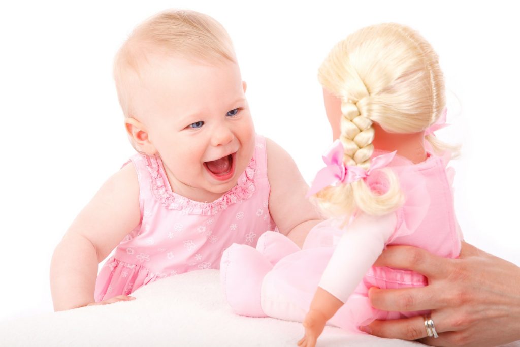 Toddler with doll