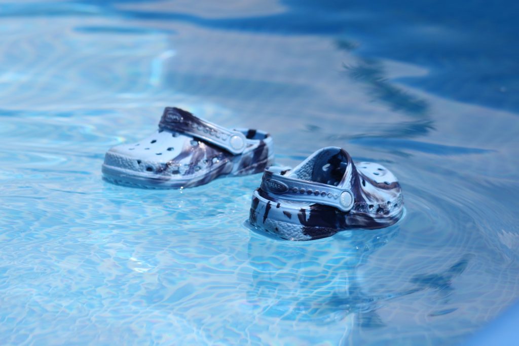 Sandals floating on water